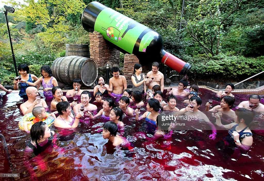 A sommelier pours a bottle of Beaujolais Nouveau to open air wine spa at the Hakone Kowakien Yunessun on November 15, 2007 in Hakone, Kanagawa Prefecture, Japan. The spa complex launched open air wine spa 2 years ago and the event is taken place every year.